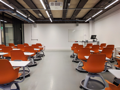 Room 1.3 Lister Teaching and Learning Centre, classroom with chairs with writing tablets.